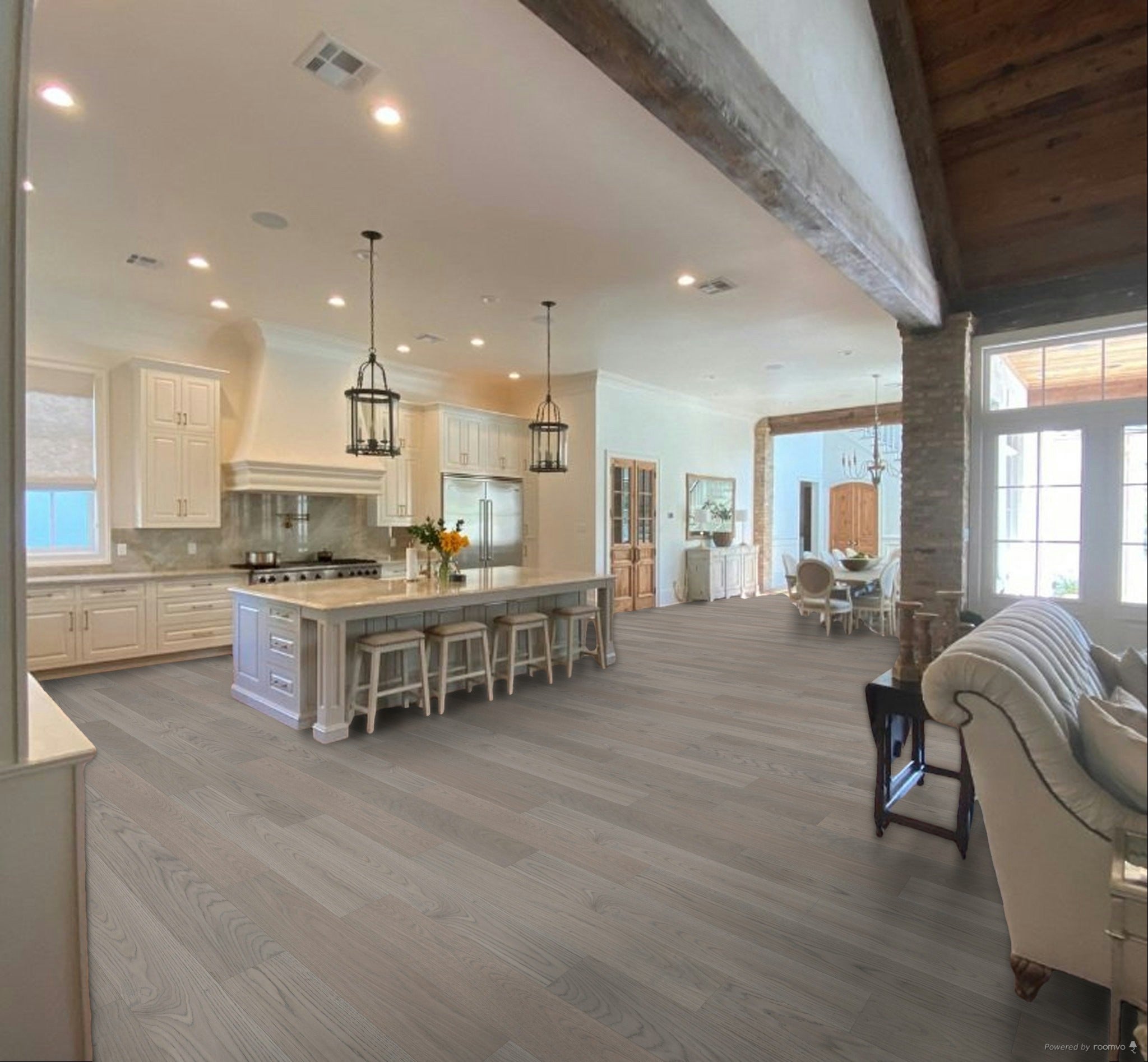 Light gray wood plank flooring shown in a bright, modern kitchen and living room interior.