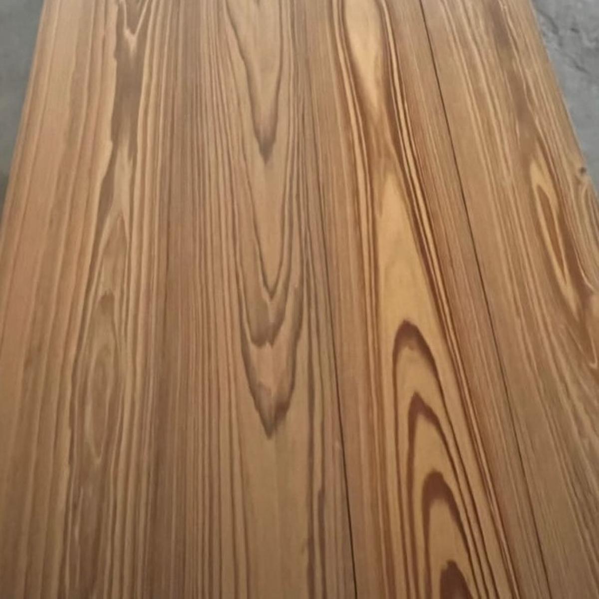 100% green Waterproof Cypress flooring — real solid wood for concrete, basements, bathrooms, and wet areas. Thermally modified and built to last.
