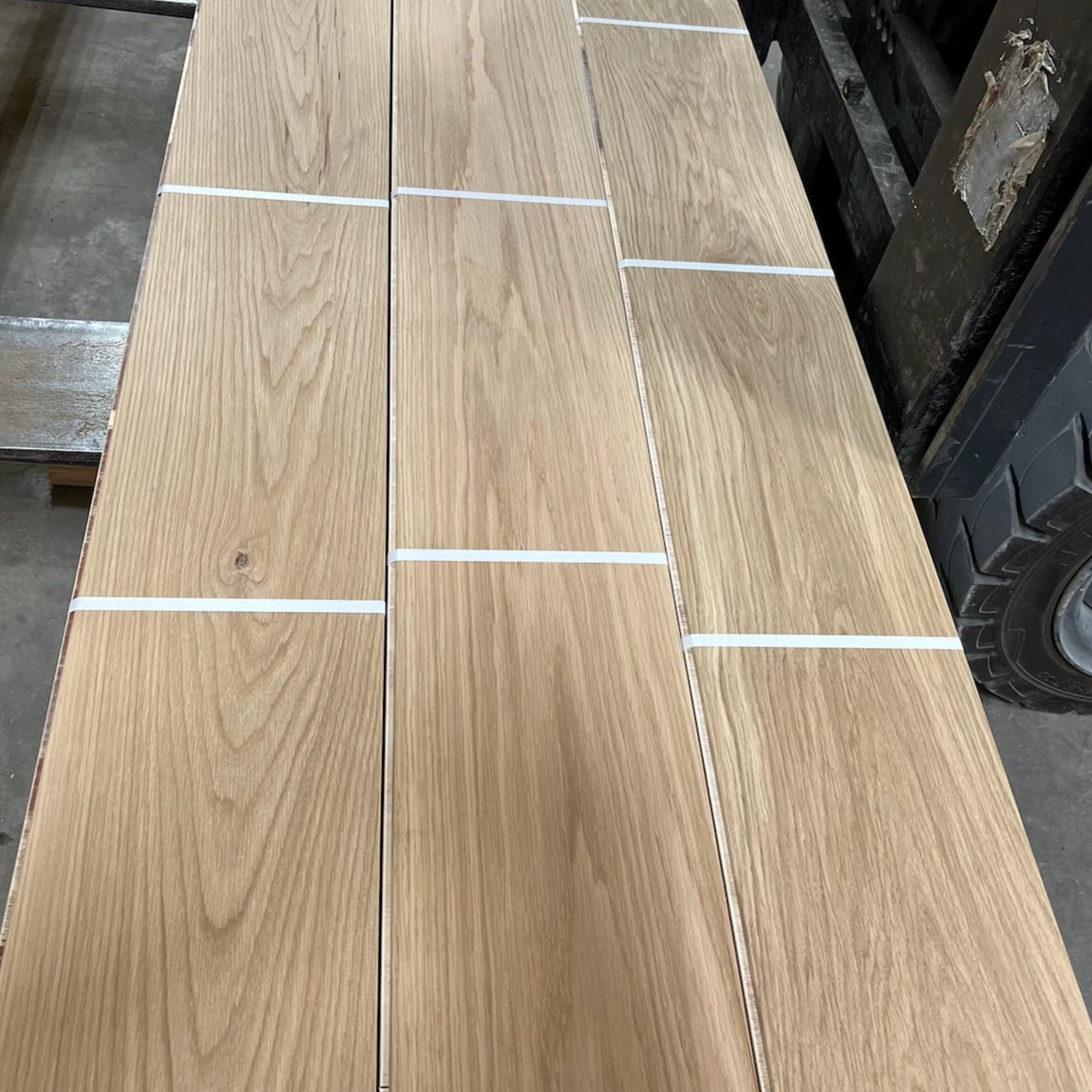 Waterproof White Oak flooring — 100% real solid wood for concrete slabs, bathrooms, radiant heat, and high-traffic areas. Thermally modified with heat and steam with 16 foot lengths